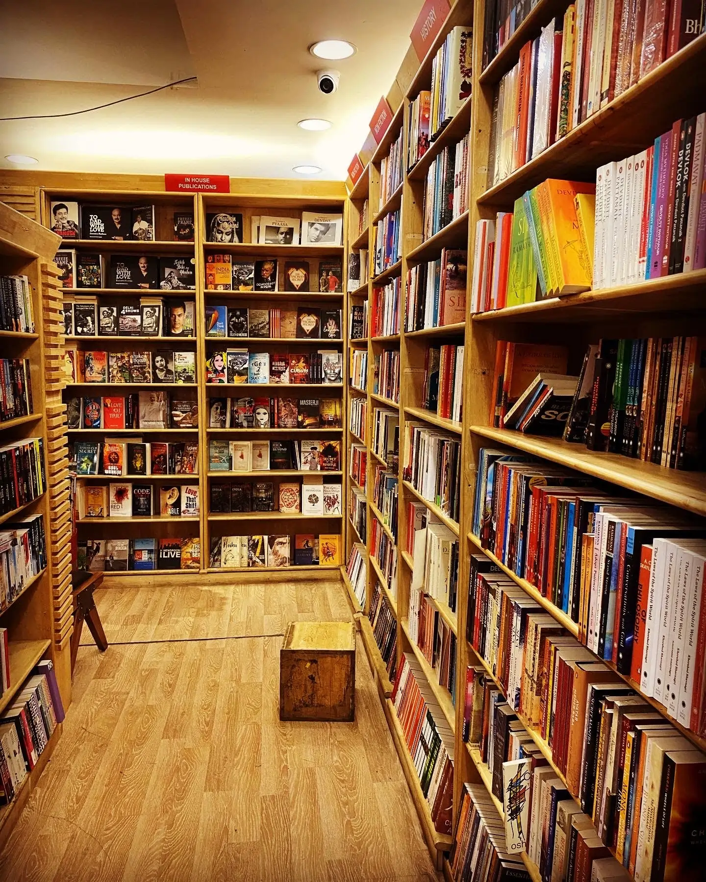 Rows of books inside a well-lit book gallery