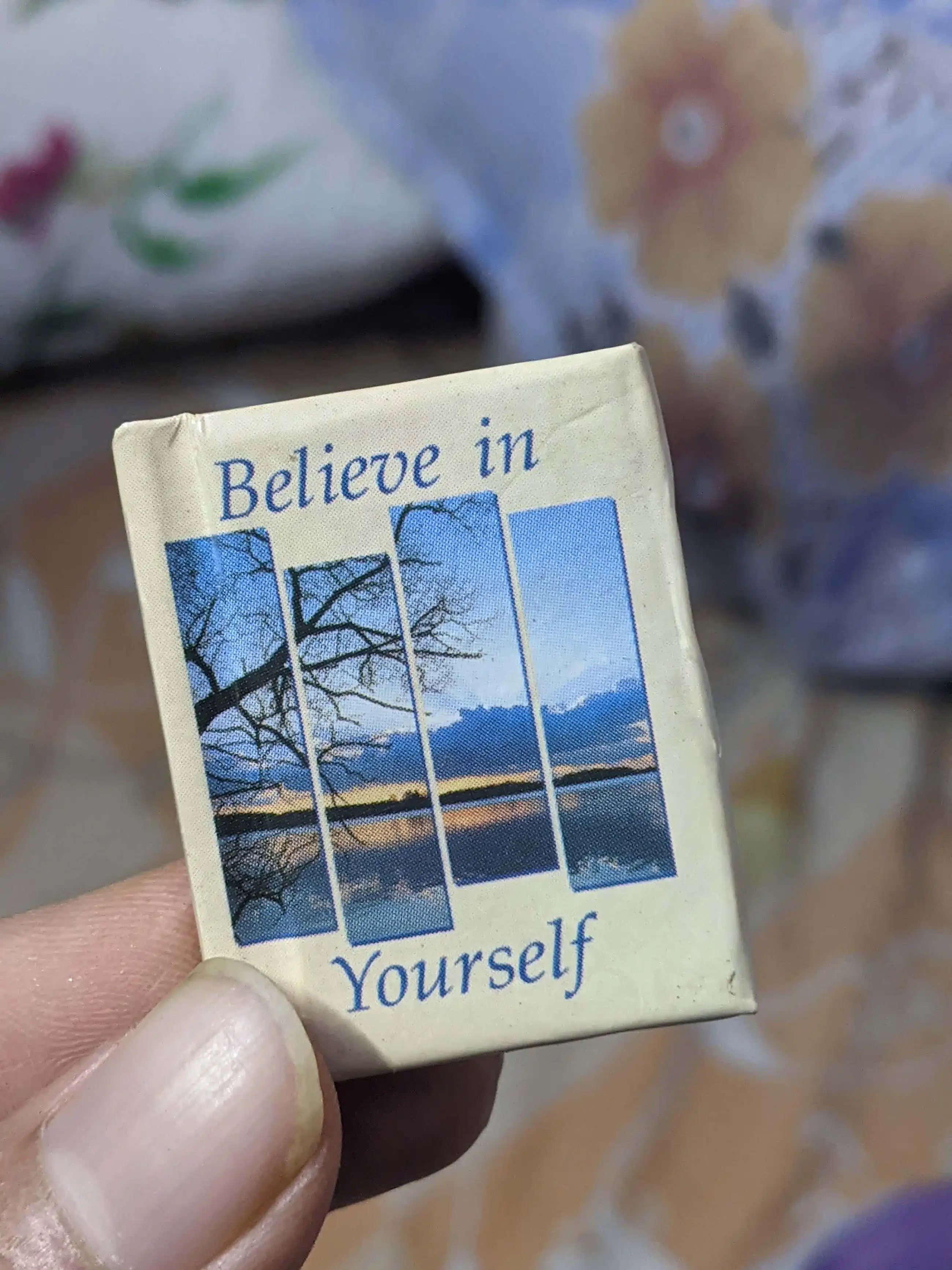 Close-up shot of a tiny diary with handwritten notes